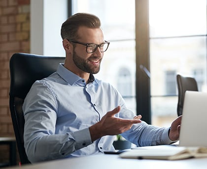 mirthful-employee-looking-at-the-laptop-screen-and-2021-10-26-01-44-20-utc